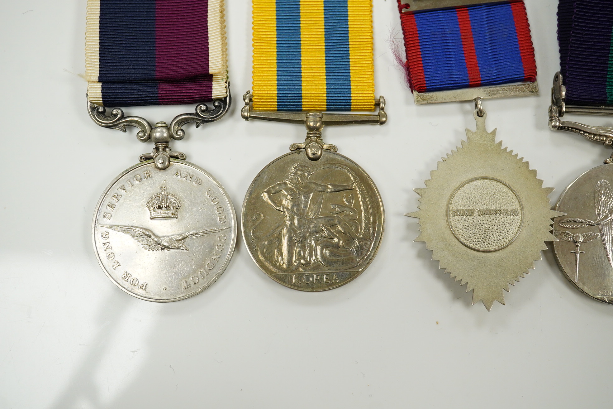 Seven military medals, including; a WWII medal group including the 1939-1945 Star, the France and Germany Star and the 1939-1945 Medal, a George V General Service Medal with a bar for Iraq awarded to GNR. G. Fuller R.A.